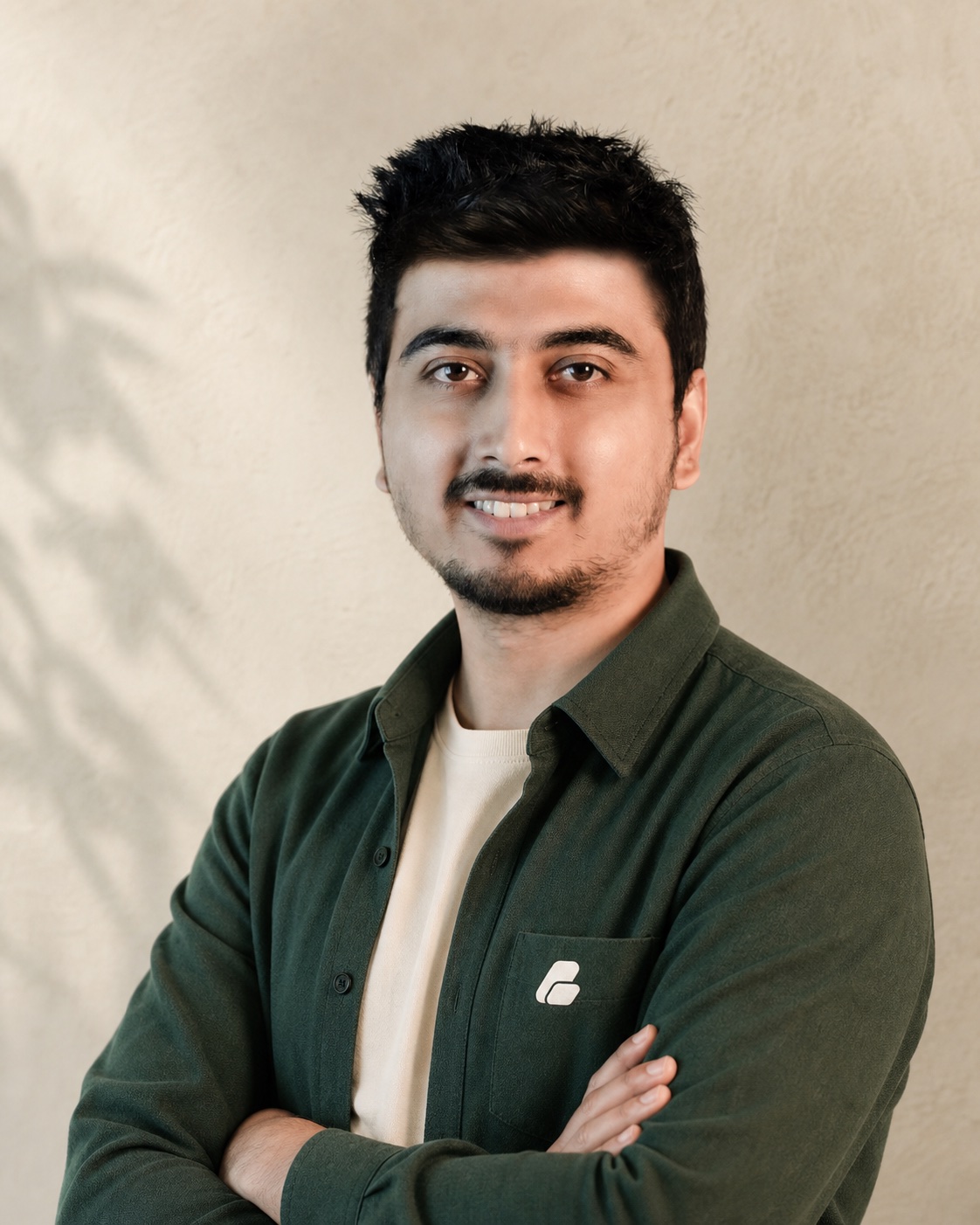Portrait of Swadhin Khan wearing his personal brand logo